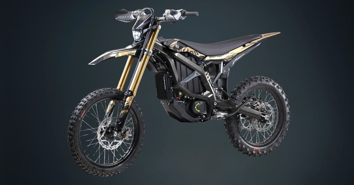 Black and gold surron ultrabee dirt bike on a dark gray background