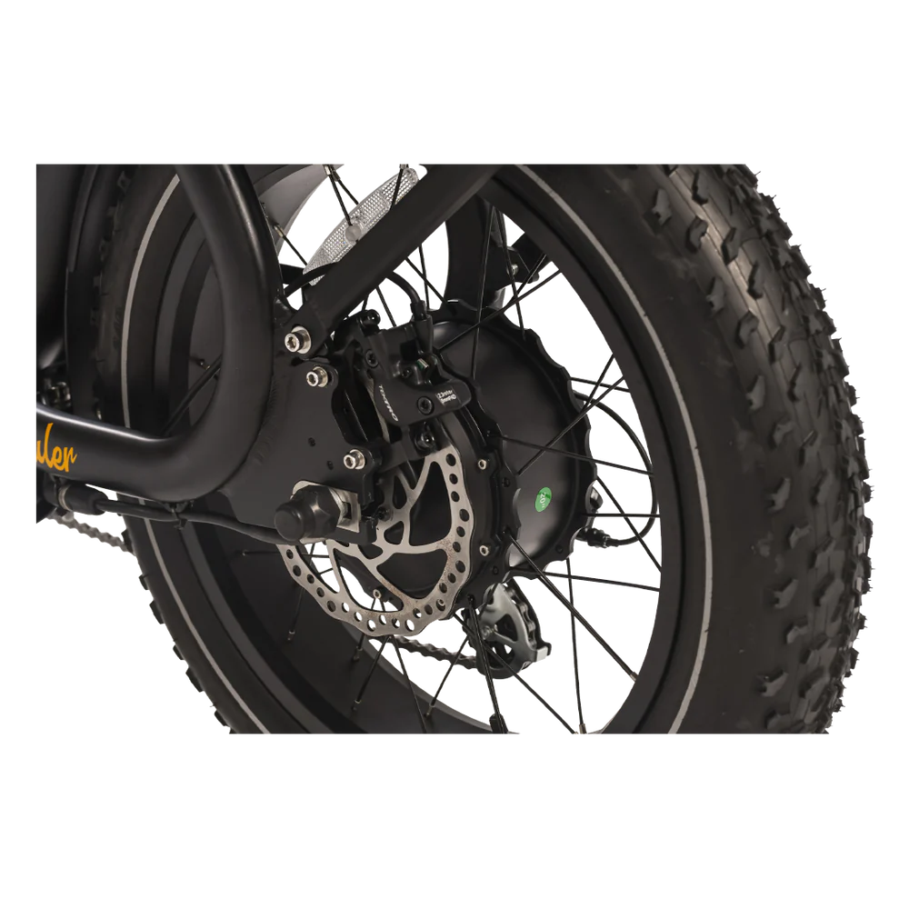 Close-up of a motorcycle wheel with disc brake on a white background