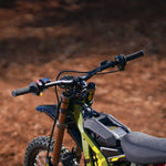 surron 2025 lightbee x  Close-up of a dirt bike handlebar with a blurred background