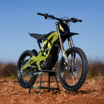 surron 2025 lightbee x Yellow electric bike on a stand with a clear blue sky background