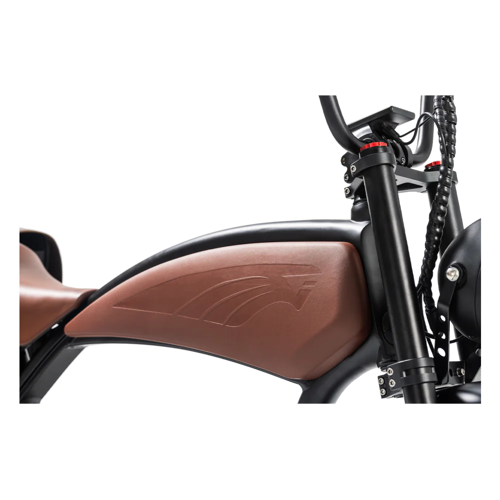 Close-up of a motorcycle's brown seat and black frame on a white background